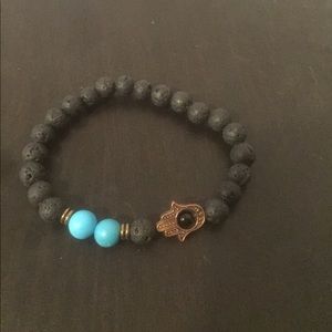 Lava rock hamsa bracelet with blue beads
