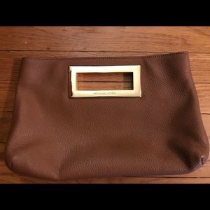 Michael Kors brown leather clutch purse.