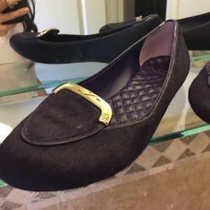 Look like new.Tory butch purple fur-like material