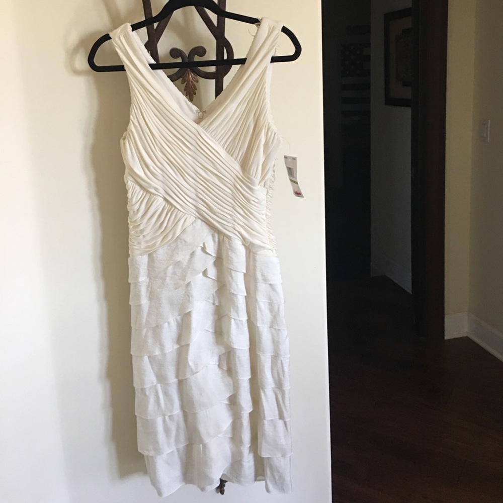 Cream cocktail dress. Very complimentary.