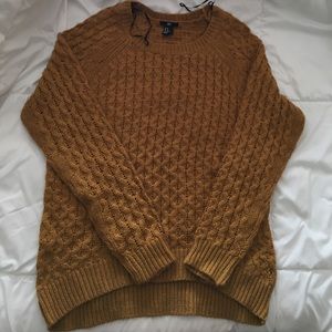 Knit sweater in mustard yellow