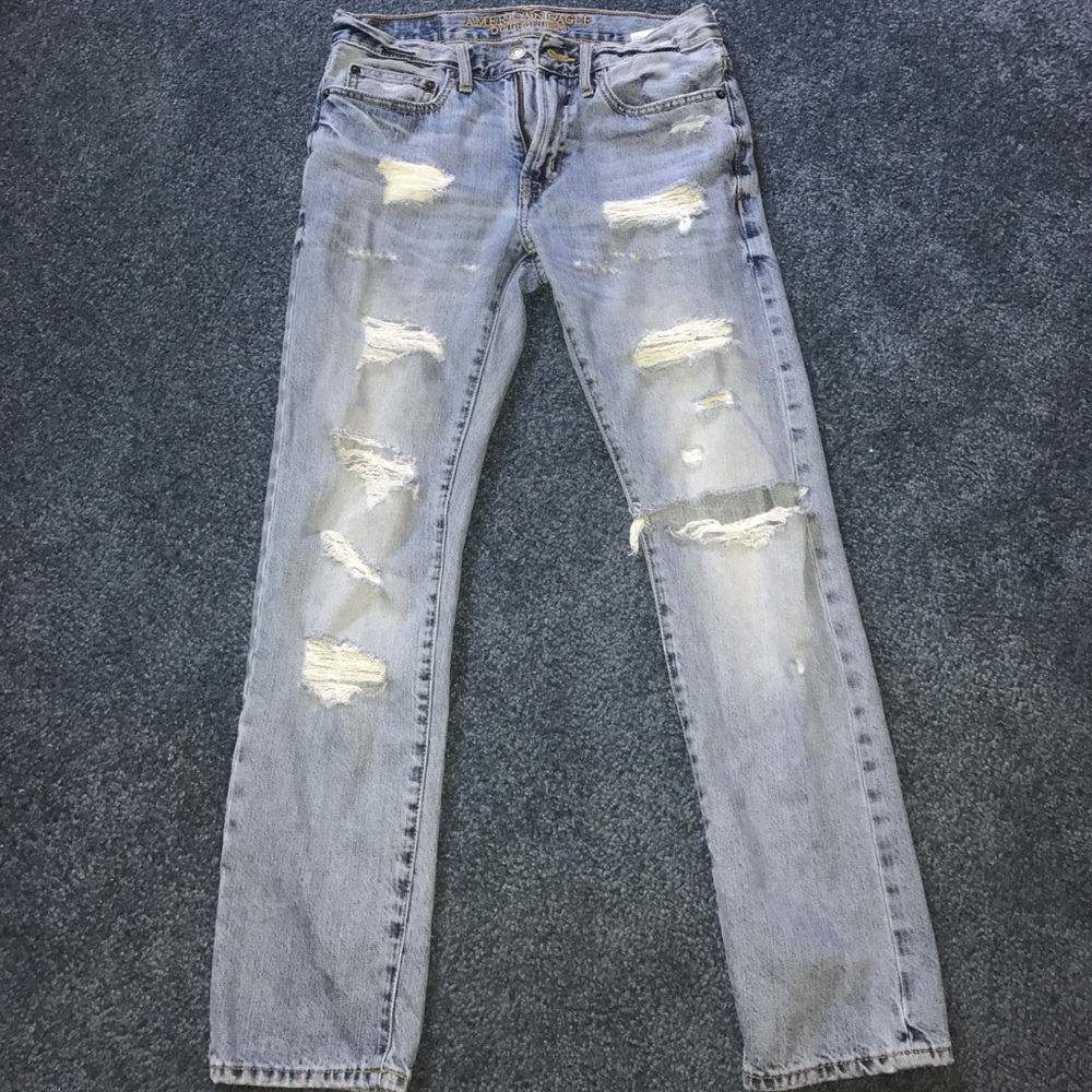Distressed and torn light wash AE jeans