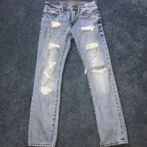 Distressed and torn light wash AE jeans