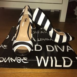 Black and white peep toe pumps