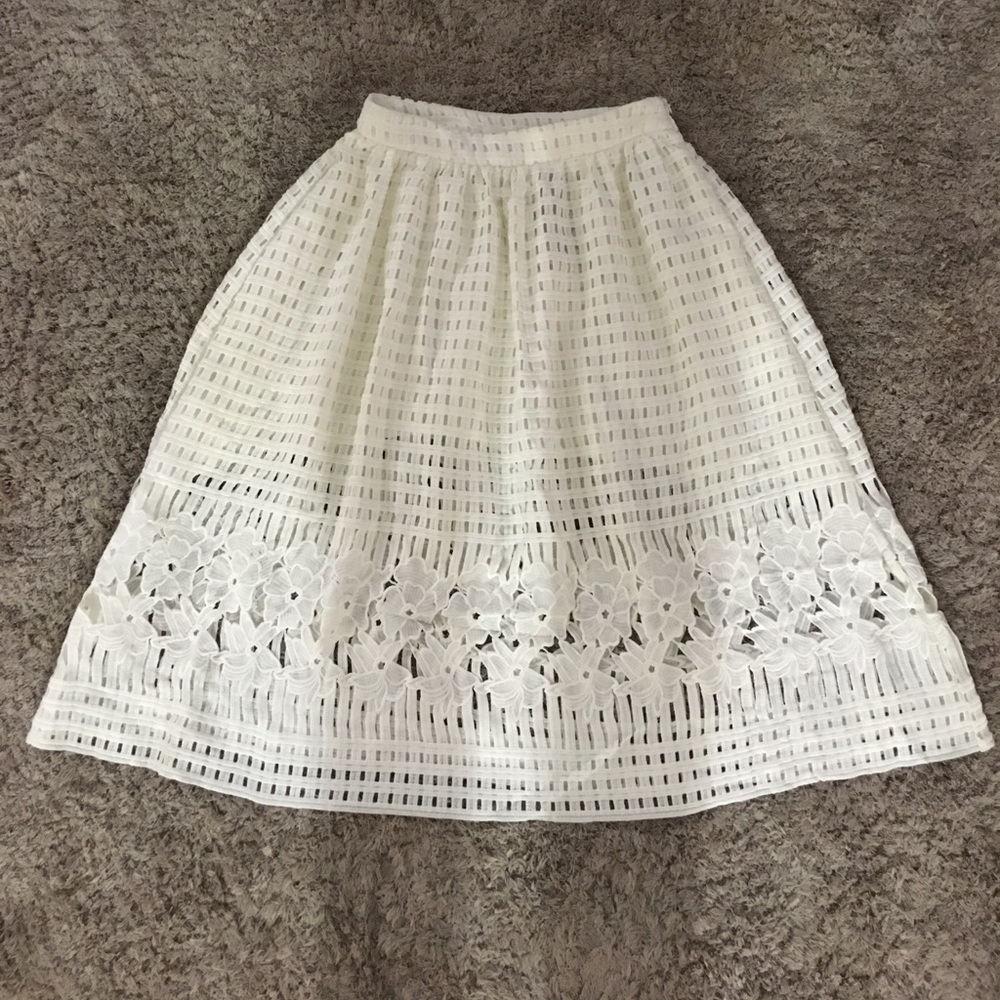 White mid length skirt.