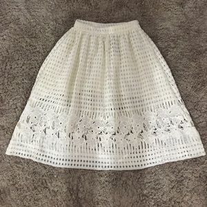 White mid length skirt.
