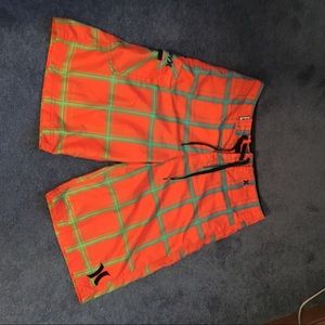 Neon orange Hurley swim trunks