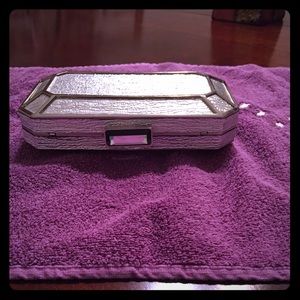 Silver Kate Landry Clutch with detachable chain.