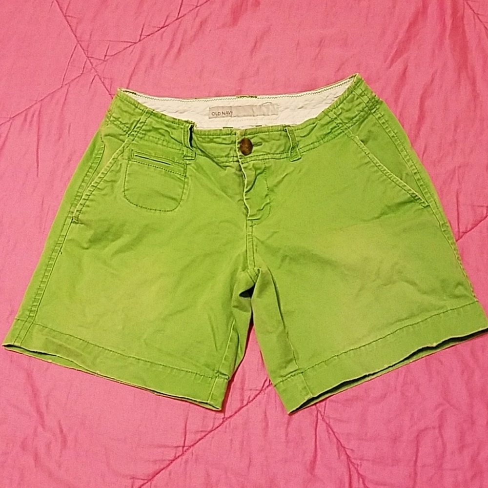 Low rise green shorts.