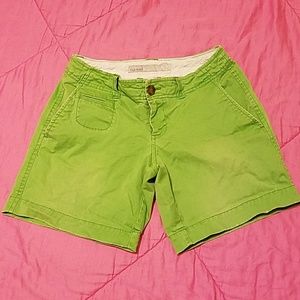 Low rise green shorts.