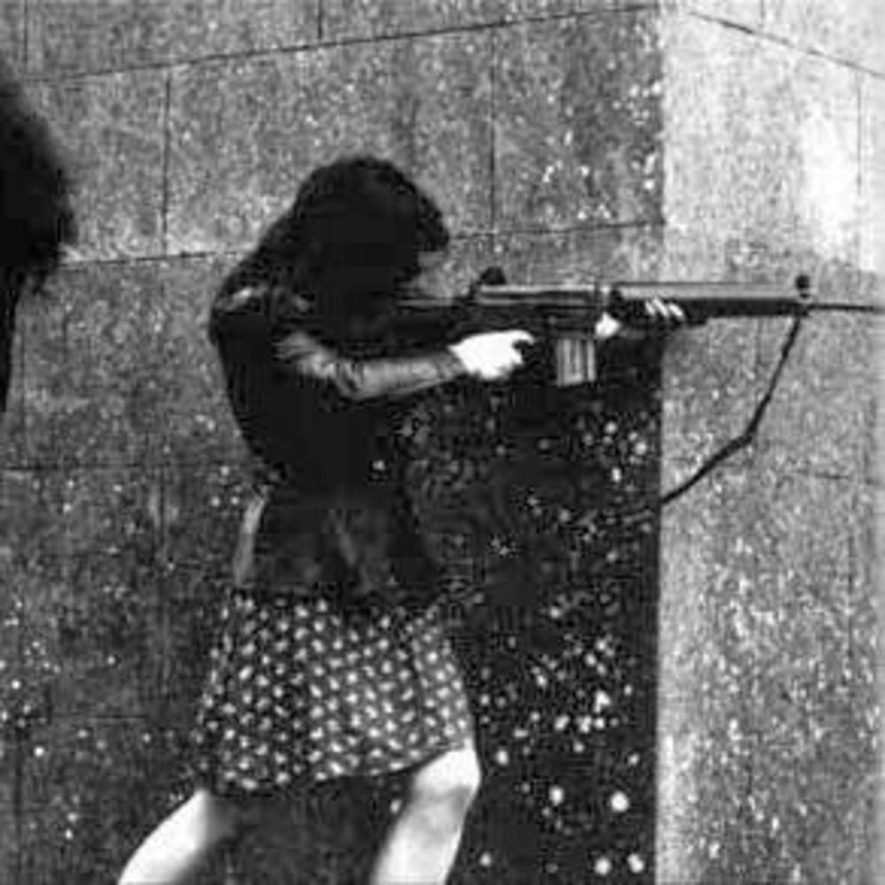 Leathers and Print Dress with AR-18 Armalite Rifle