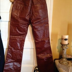 Leather burgundy tone.  Beautiful in person. NEW