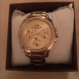 Gold stainless steel coach watch in new condition