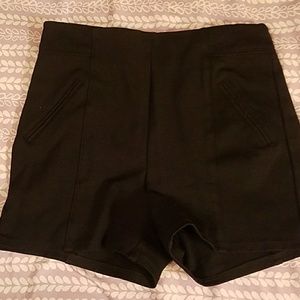 Have high waisted black shorts