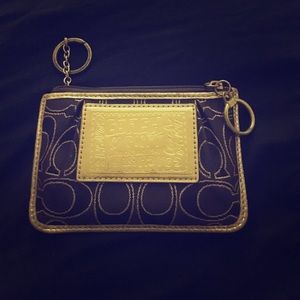 Coach Poppy purple and gold wristlet