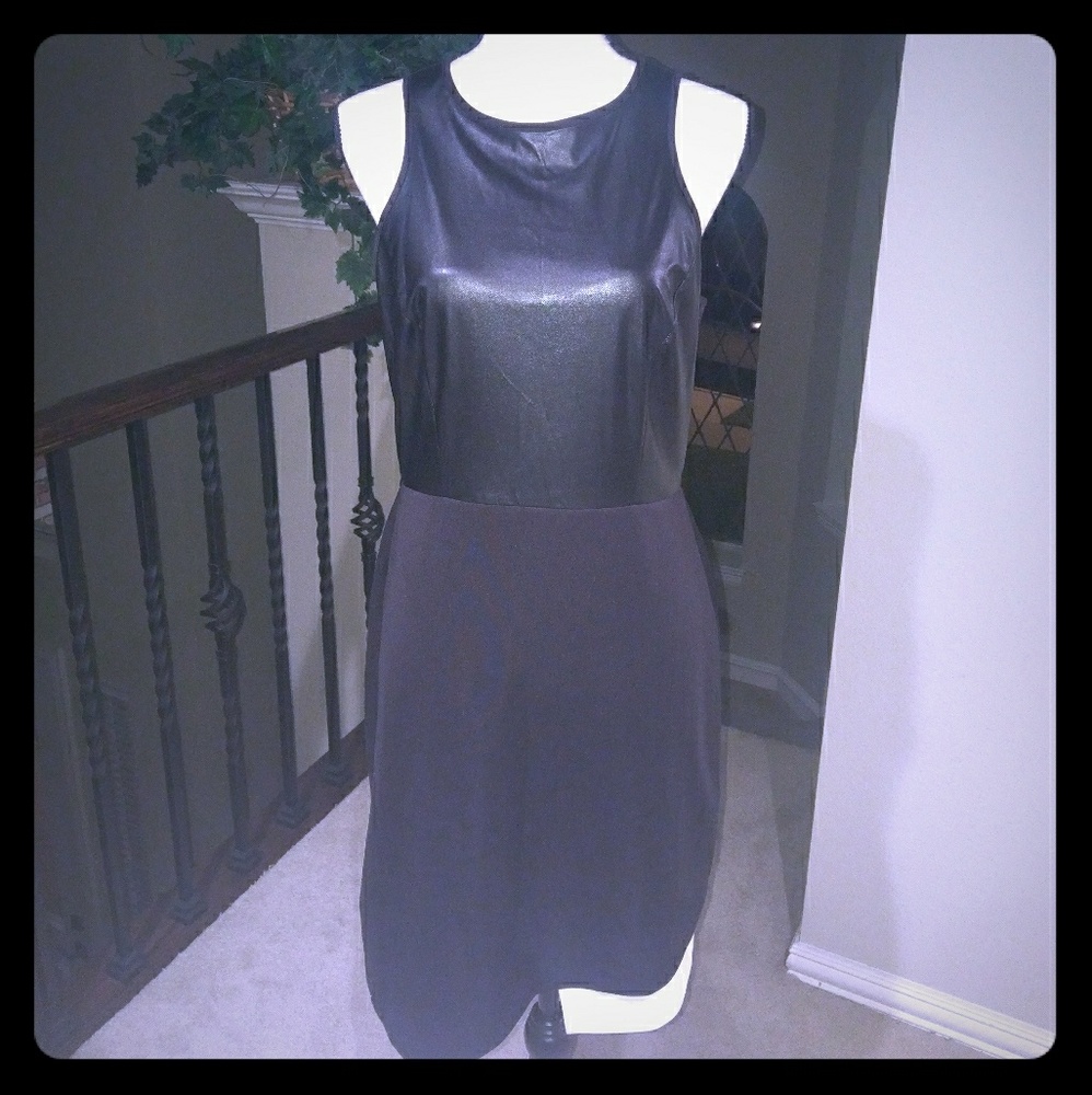 Black dress with leather and white bottom detail.