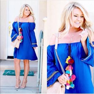 Bright blue, off the shoulder sundress.