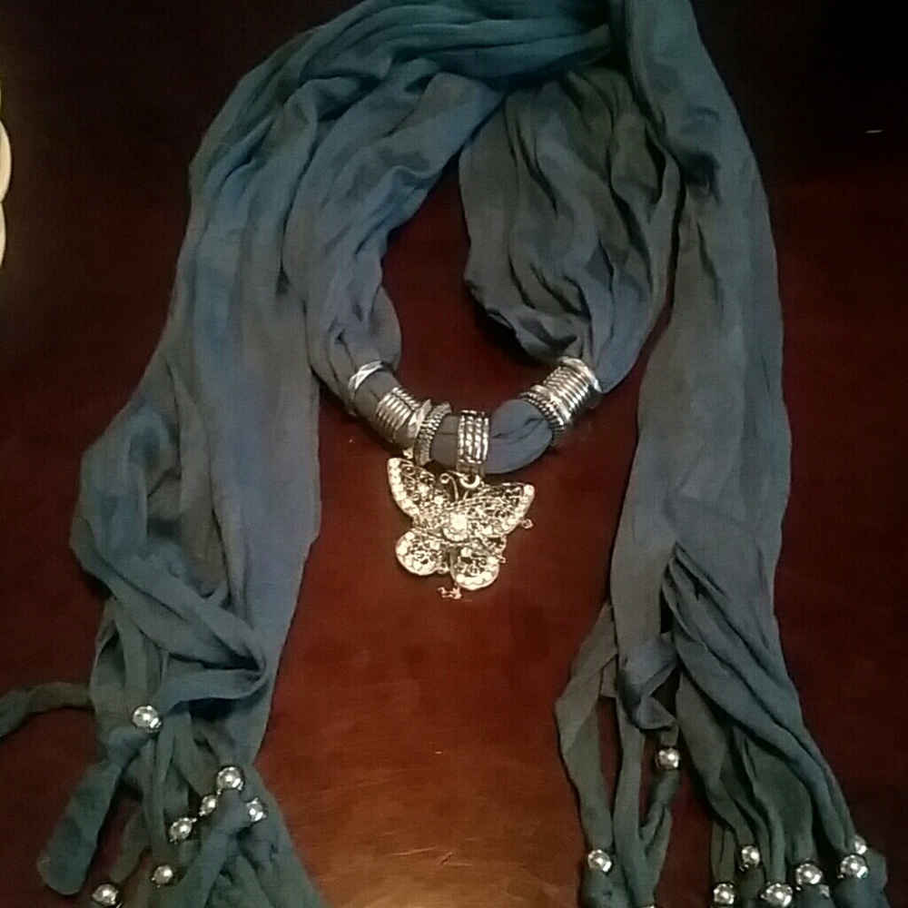 Fashion scarf with silver/ butterfly accents.