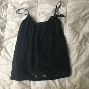 A blue shirt w flower designs