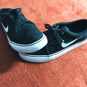 Black & white Nike SBs