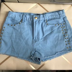 Blue studded denim shorts