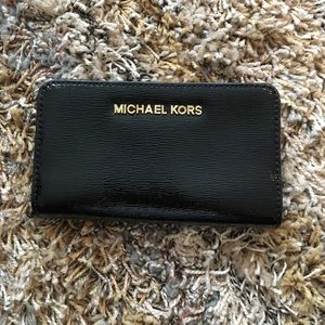 MK black and gold wallet.