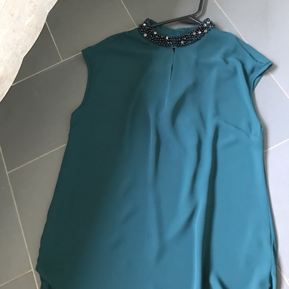 Green tunic with beading