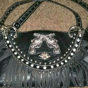 All leather black purse with two silver guns