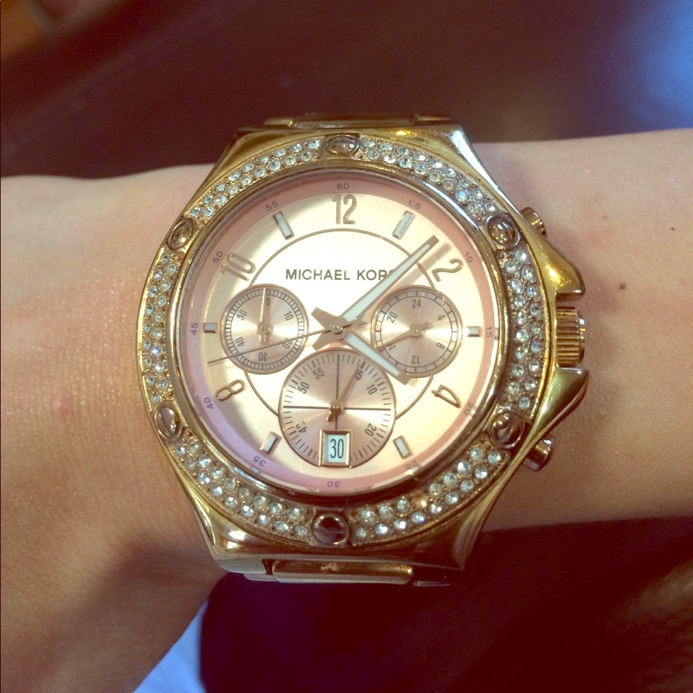MK rose gold watch.
