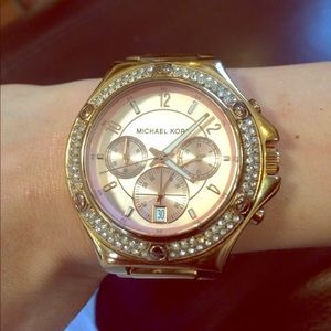 MK rose gold watch.
