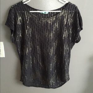 Grey top with sheer sequins and transparent holes