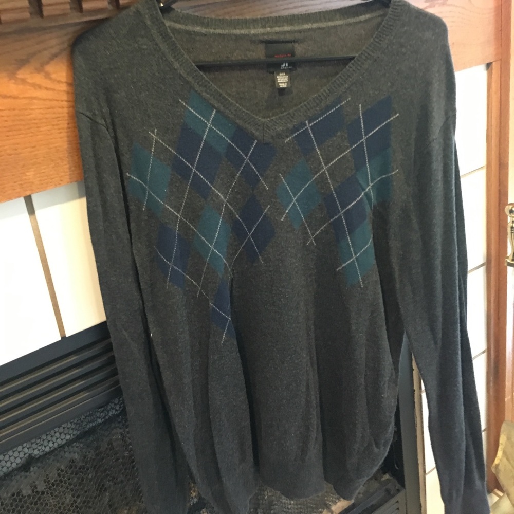 Dark gray, white, navy and dark green sweater.