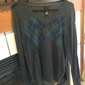 Dark gray, white, navy and dark green sweater.