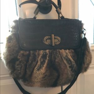 Faux fur handbag with adjustable strap and handles