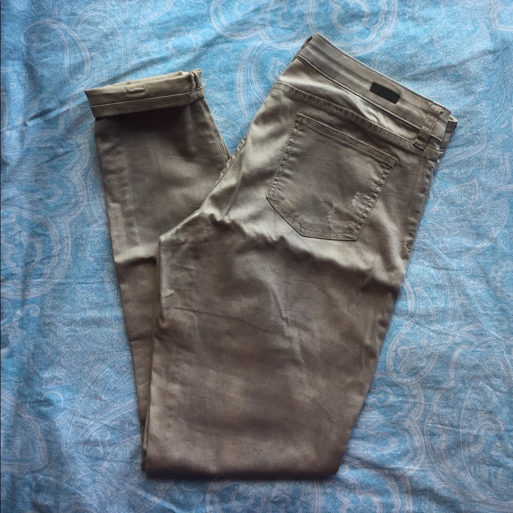 Distressed khaki skinny jeans