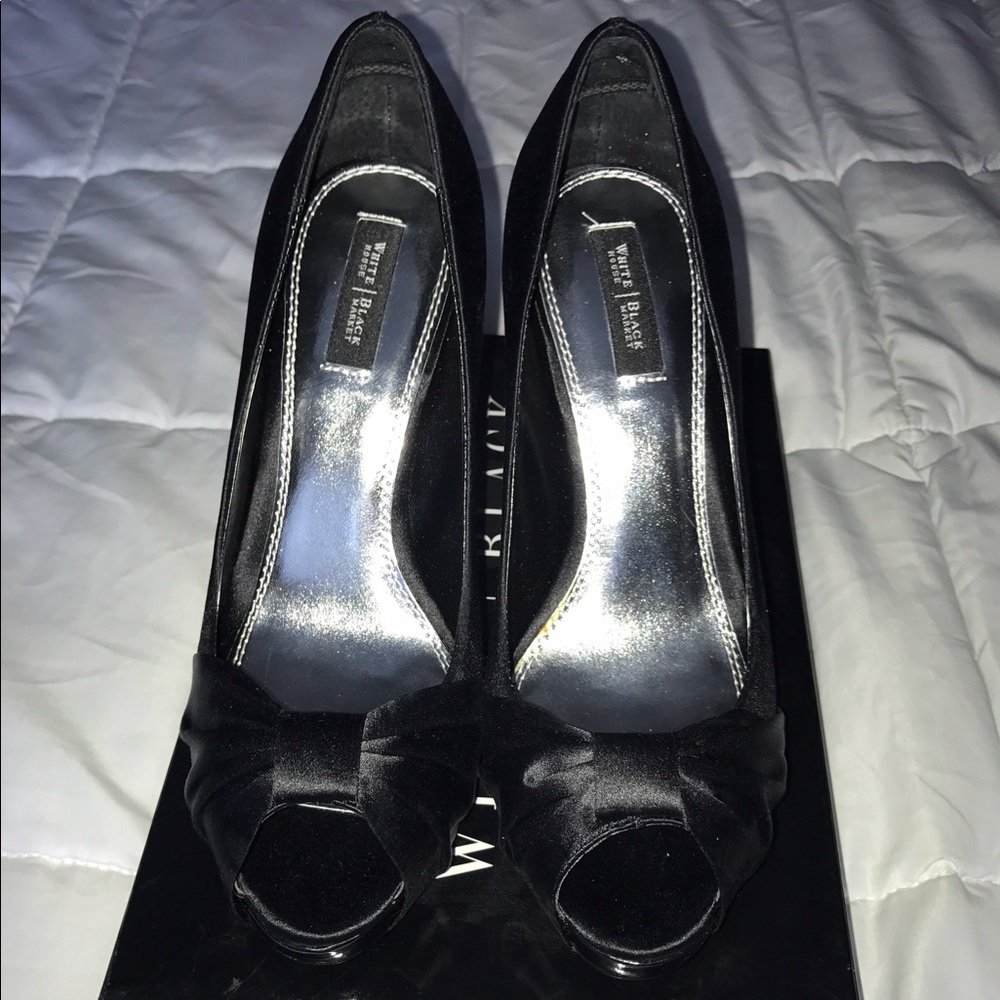 Black satin peep toe pumps with 4" patent heel