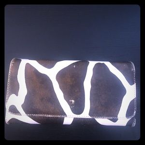 Wallet that is giraffe print.