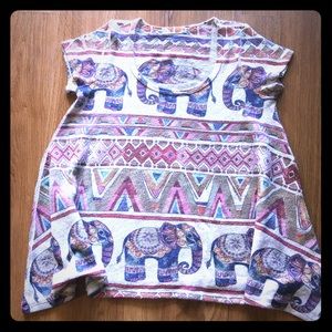 Flared colorful elephant shirt.