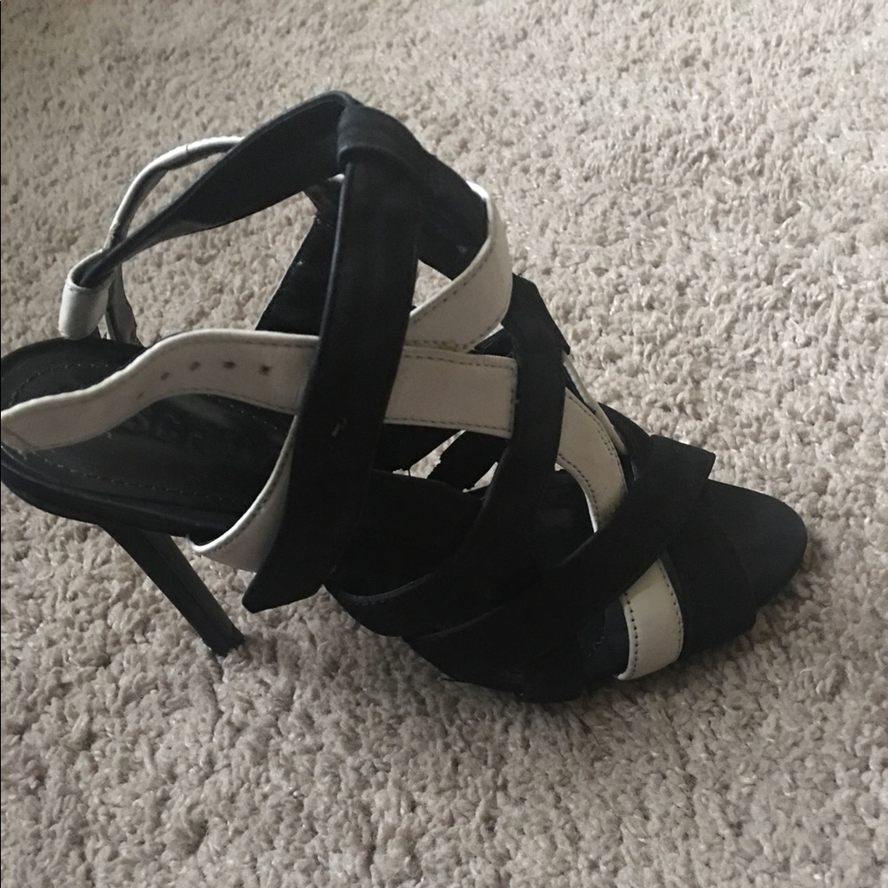 Black and white Schutz sandals .