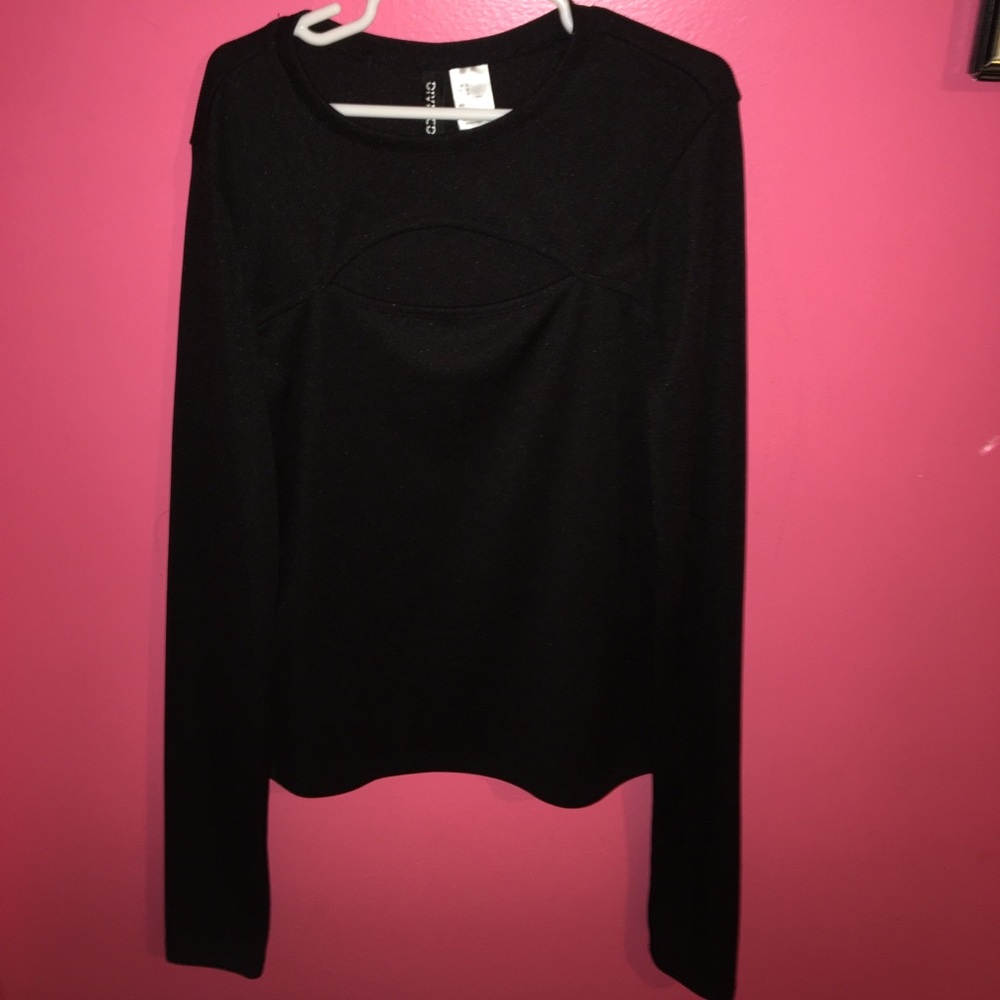 Black long sleeve shirt with cut in chest area.