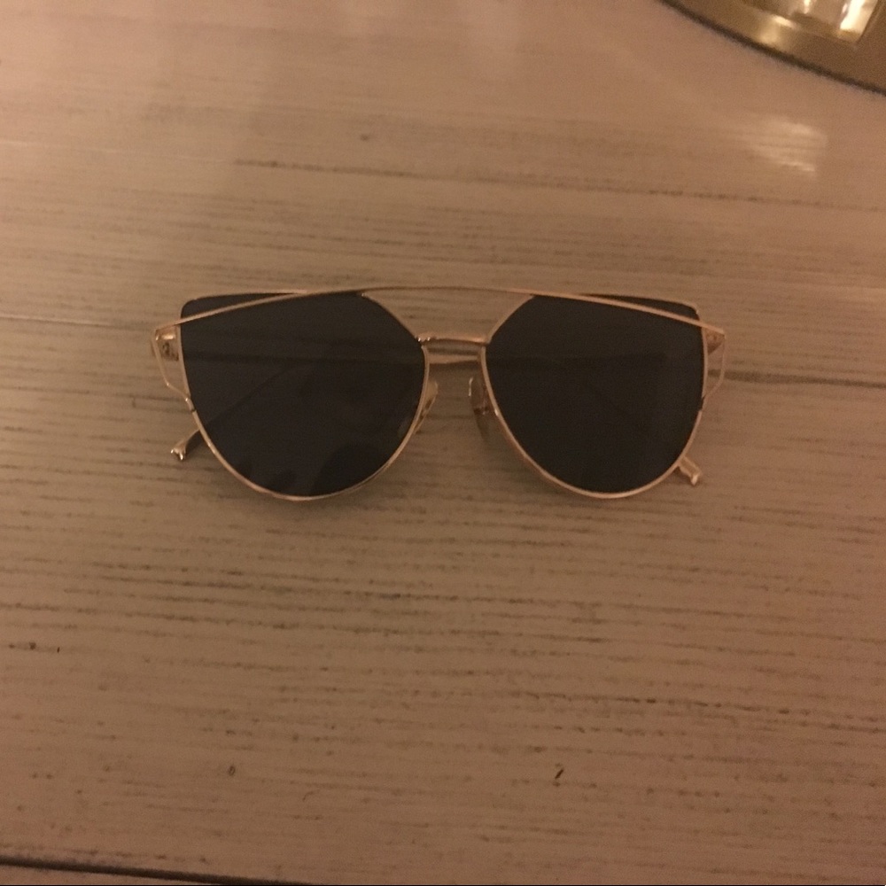 Black sunglasses with gold frame