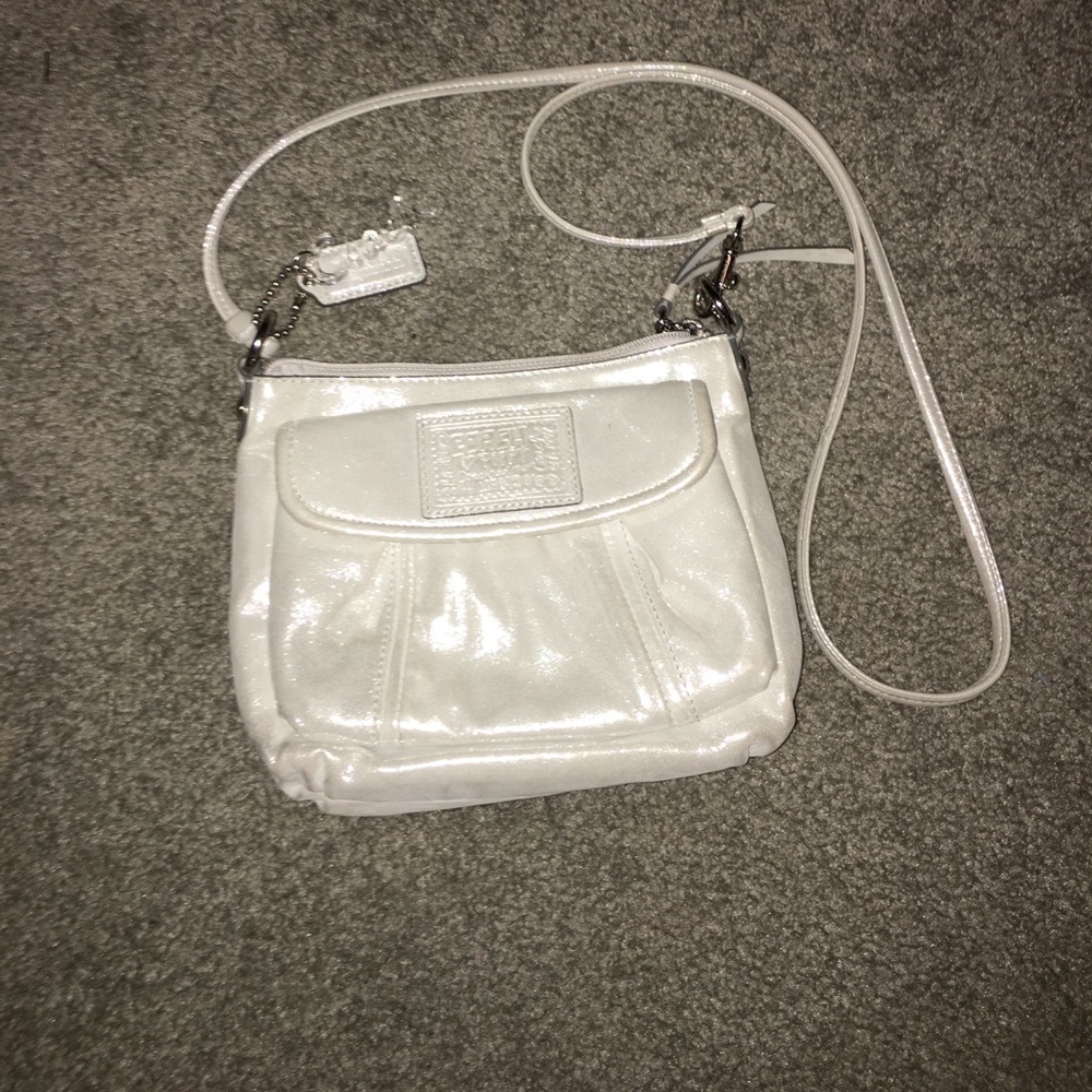 White cross shoulder coach purse
