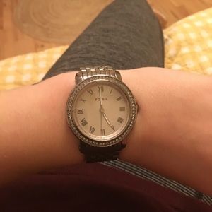 Silver fossil watch with mother of pearl face