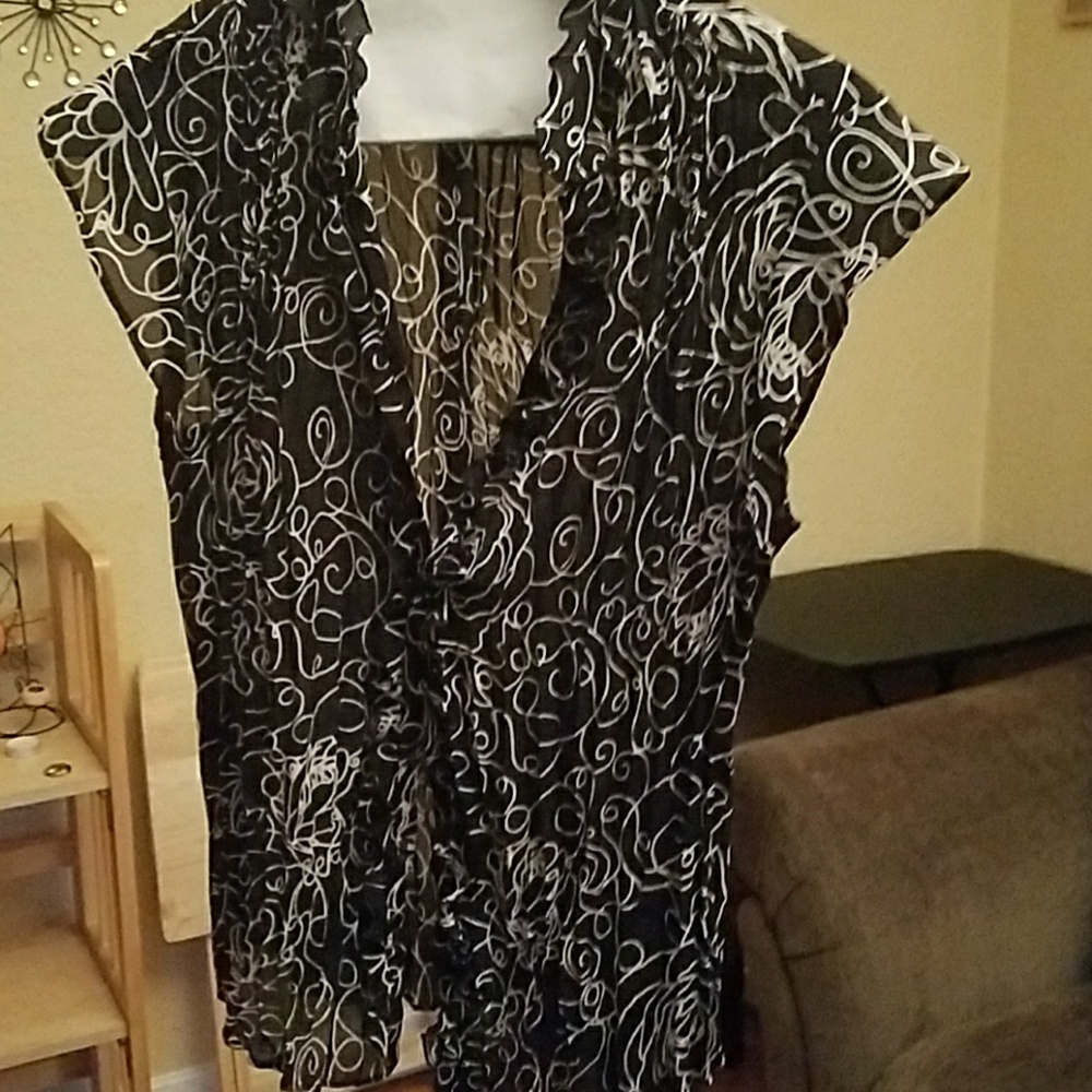 Blouse with some ruffles along neck and buttons