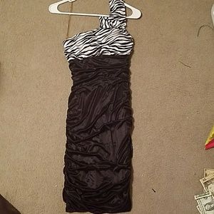 A black & white dress with zebra print on the top.