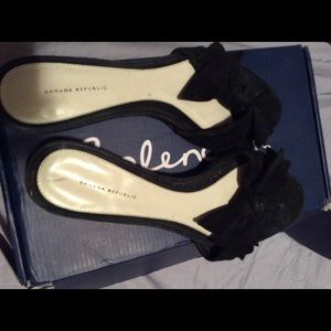 Black suede bow slide ins