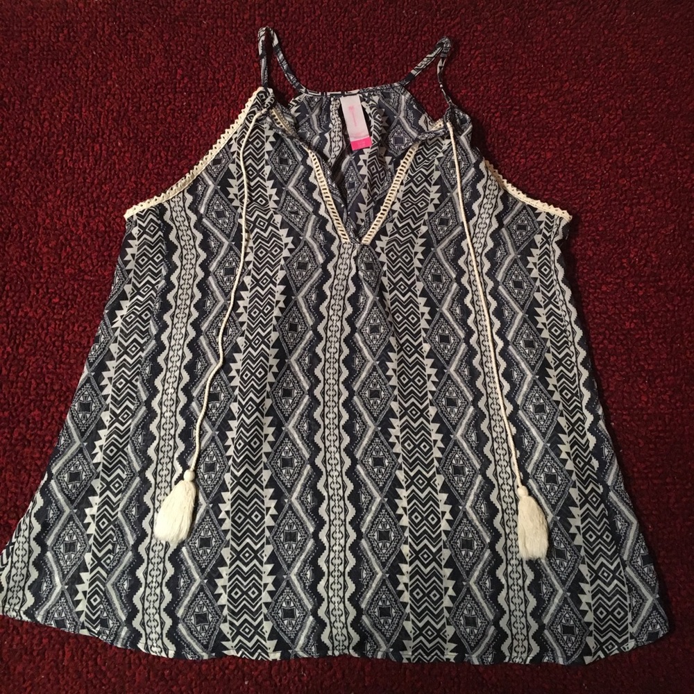 No boundaries sheer tank with tassels