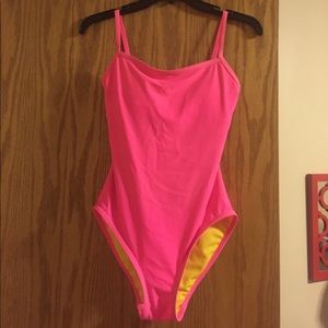 Neon Pink one piece swimsuit. Still has padding