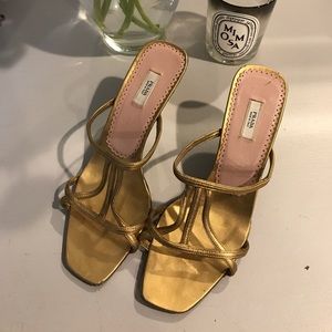 Gold Prada kitten heels 👠.