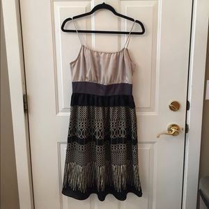 Polyester, knee length, spaghetti strap dress.